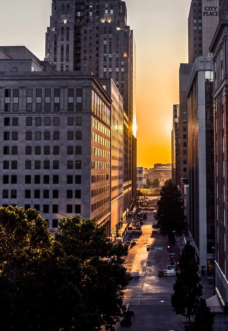 Photo of city skyline with sunset in the background