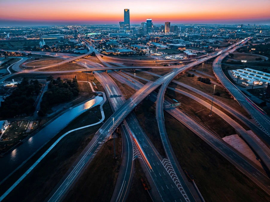 Photo of Oklahoma City skyline at sunset with busy highways
